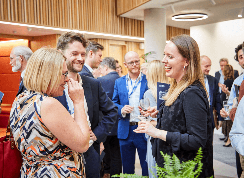 Guests chat to each other during network drinks reception