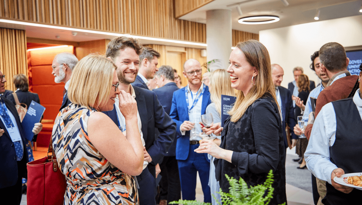 Guests chat to each other during network drinks reception