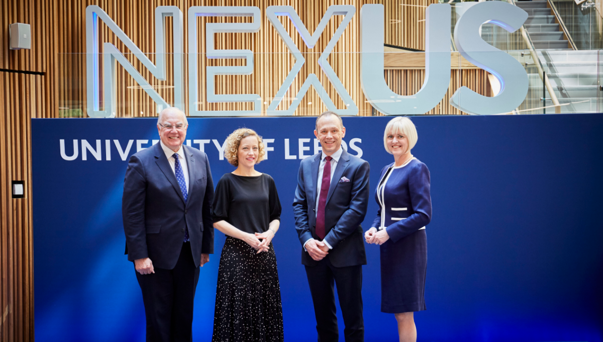 Group photo of (from right to left) Sir Alan Langlands, Cathy Newman, Dr Martin Stow and Professor Lisa Roberts. They are all stood on a blue stage with Nexus logo behind them