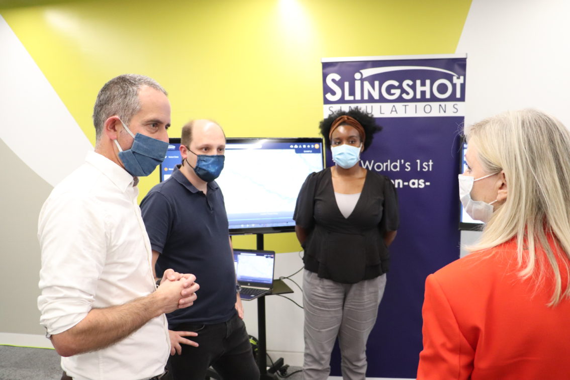 Tracy Brabin having a conversation with 3 representatives from Slingshot Simulations