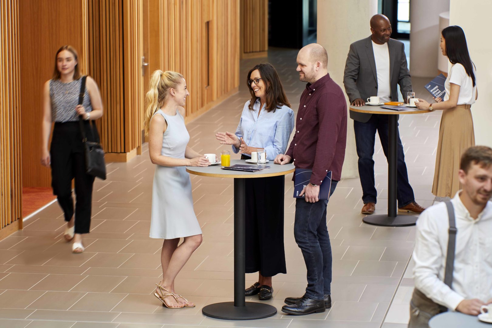 Nexus members networking in the atrium.