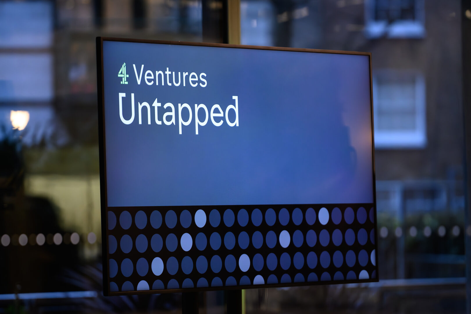 Television screen showcasing 4 Ventures Untapped.