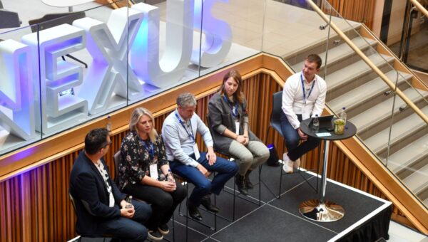 5 people talking on a panel