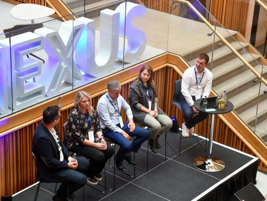 5 people talking on a panel