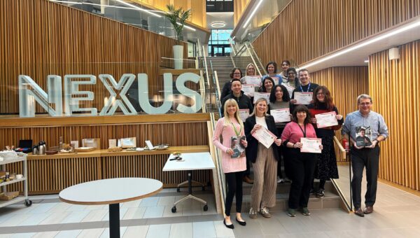 Nexus team members with Ellie MacDonald holding certificates for mental health training