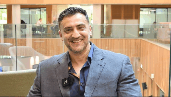 Adnan Ashfaq from Simplimedica smiling to camera.