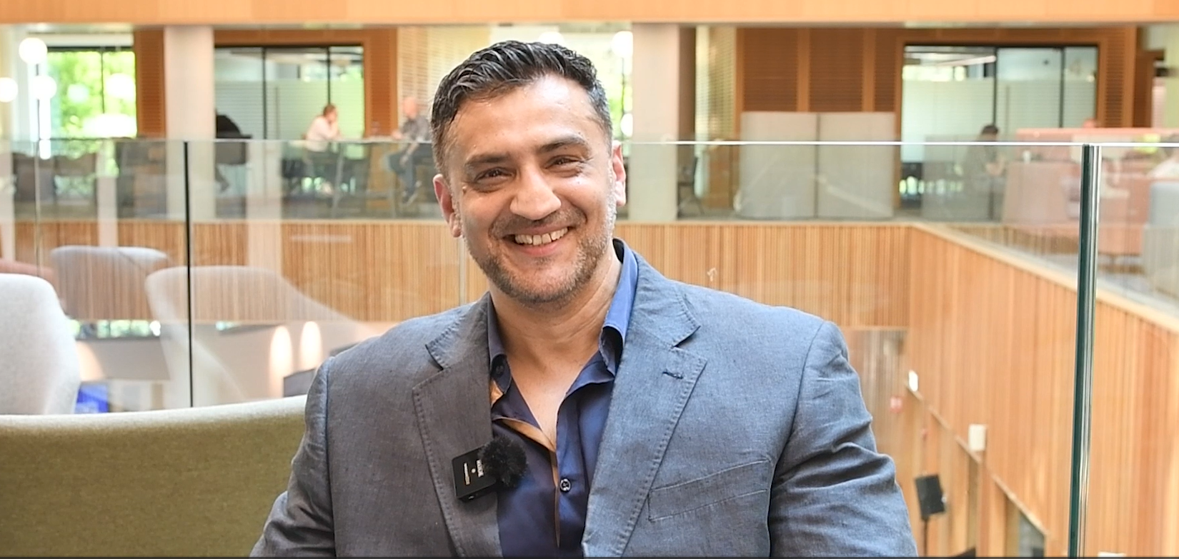 Adnan Ashfaq from Simplimedica smiling to camera.