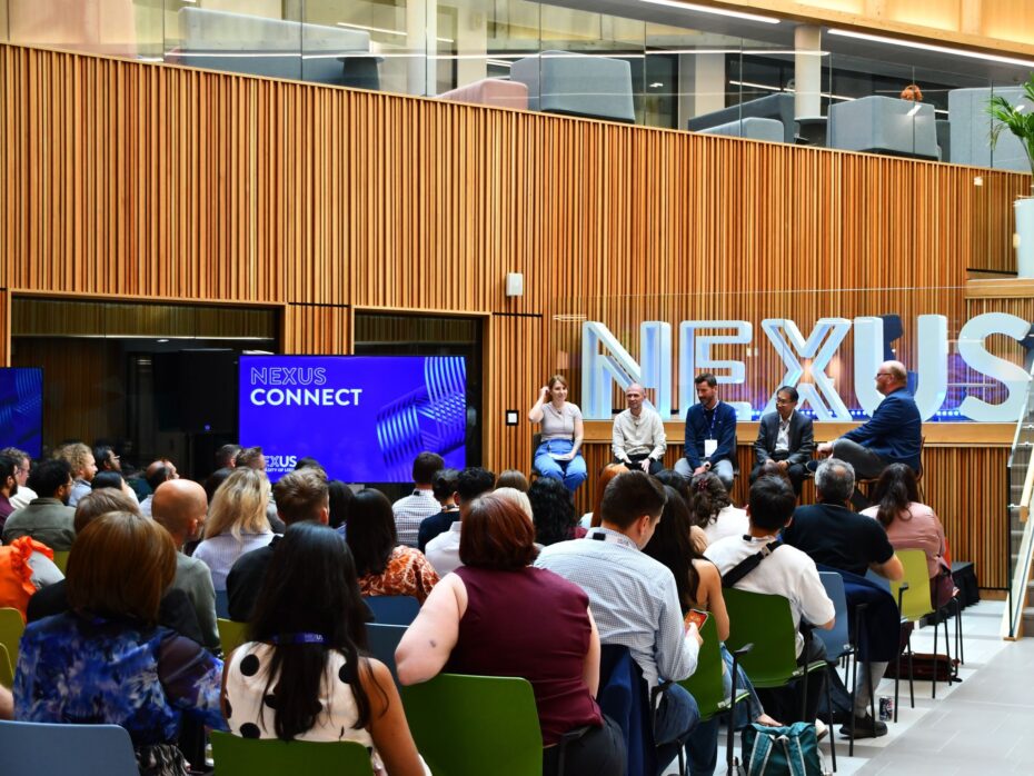 Audience watching a panel discussion
