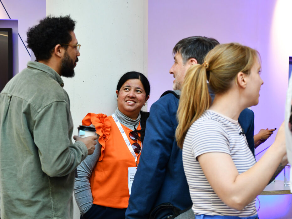 People smiling and networking at Nexus Connect.