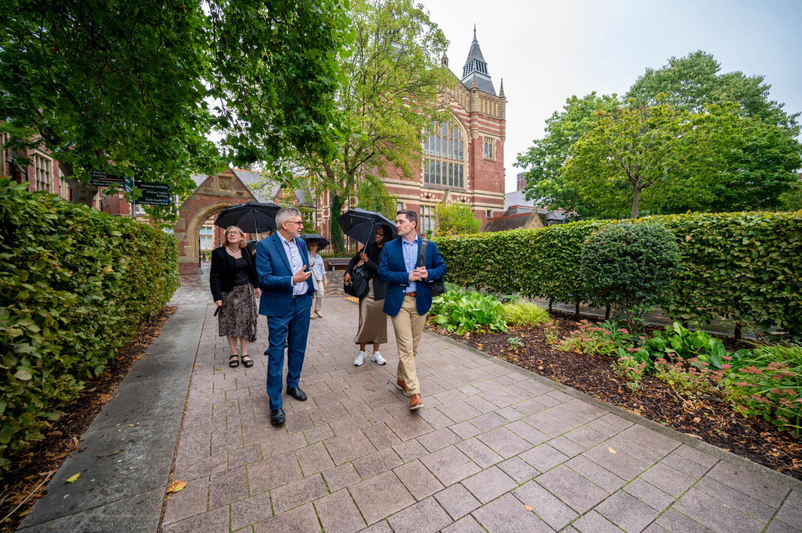 Lawrence Tallon and MHRA Leadership Team walking around University of Leeds.