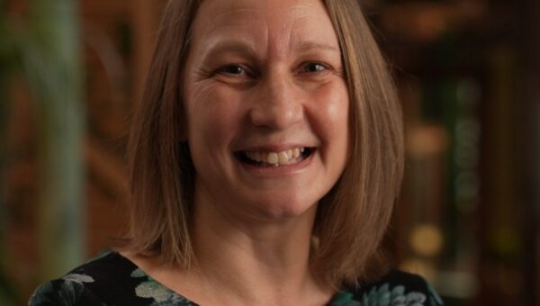 Lindsay Georgopoulos smiling to camera.