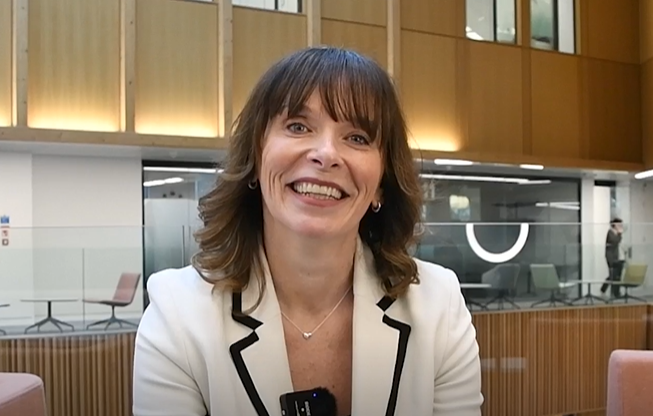 Kelly Hobson smiling to camera.