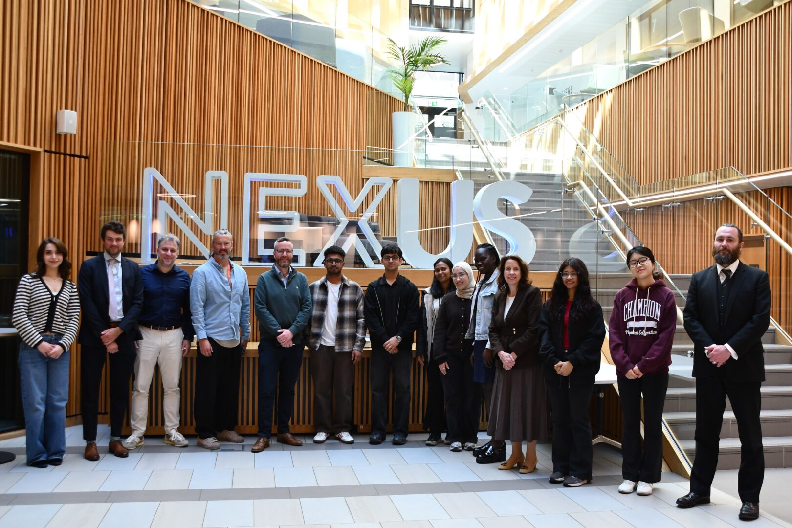 Students, UoL staff and FCA delegation around the NEXUS letters