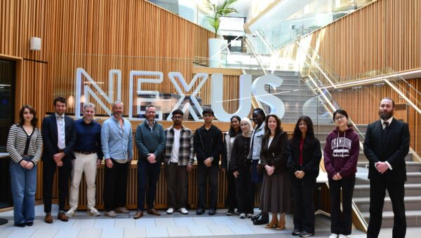 Students, UoL staff and FCA delegation around the NEXUS letters