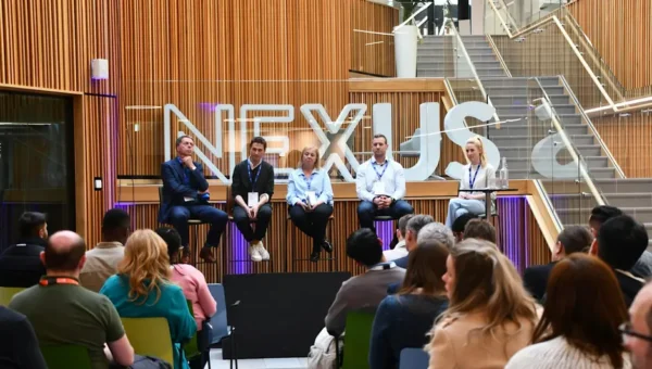 Panelists talking to an audience